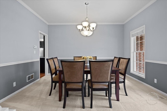 dining room with light carpet, baseboards, visible vents, crown molding, and a notable chandelier