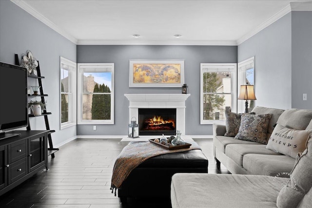 living area with dark wood-type flooring, plenty of natural light, and crown molding