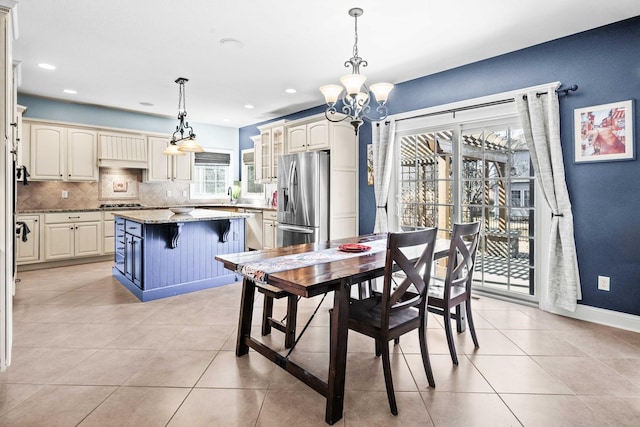 dining area with light tile patterned floors, recessed lighting, a chandelier, and baseboards