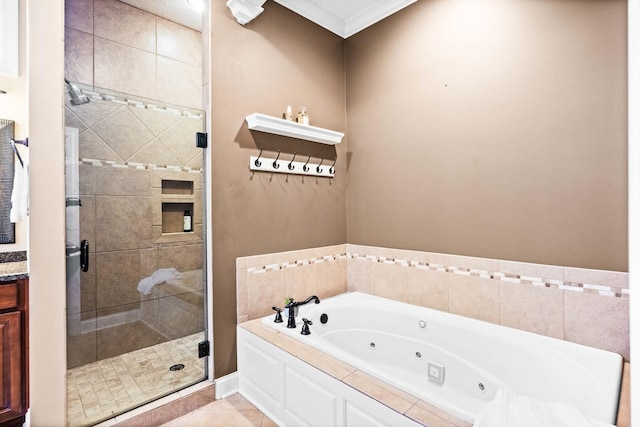 full bathroom with a jetted tub, tile patterned flooring, a shower stall, and vanity