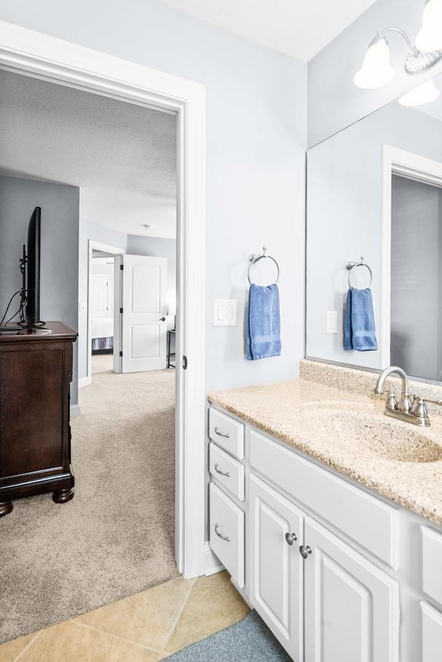 bathroom with vanity and tile patterned floors