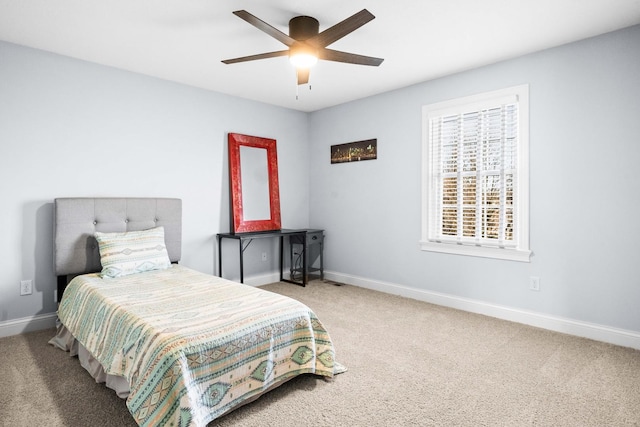 bedroom with carpet floors, a ceiling fan, and baseboards