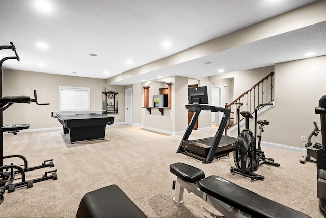 exercise room featuring recessed lighting, light colored carpet, and baseboards