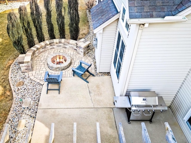 view of patio featuring an outdoor fire pit and area for grilling