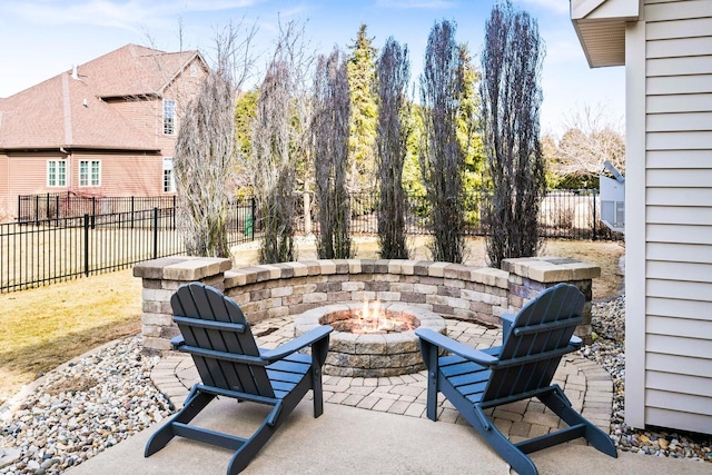 view of patio / terrace with an outdoor fire pit and a fenced backyard