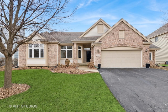 view of front of house featuring a garage, driveway, and brick siding