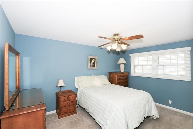 bedroom with carpet floors, ceiling fan, and baseboards