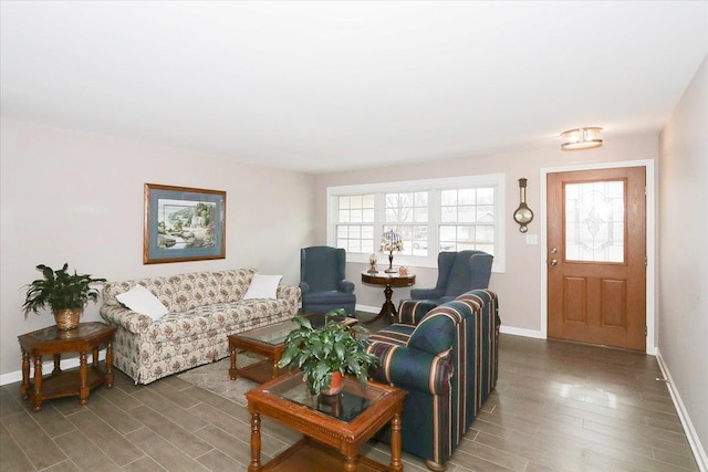 living room featuring wood finished floors and baseboards