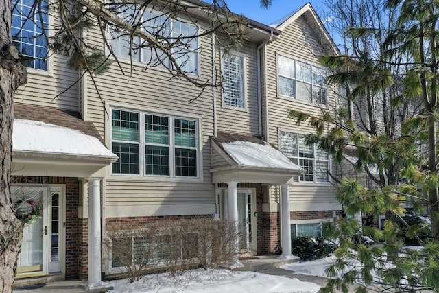 view of front of house featuring brick siding