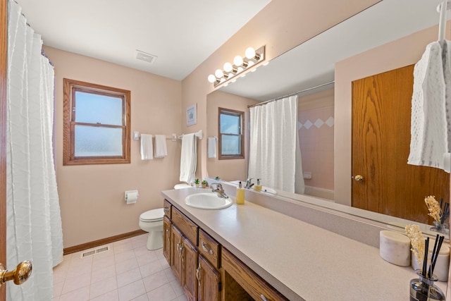 full bathroom featuring visible vents, plenty of natural light, and toilet