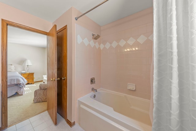 full bath featuring shower / bath combination with curtain, connected bathroom, and tile patterned floors