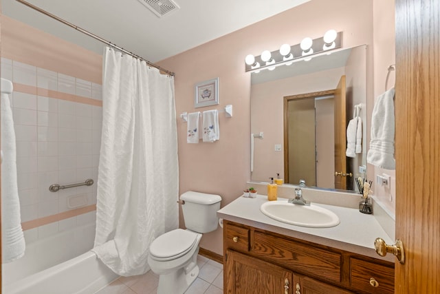 bathroom featuring tile patterned flooring, toilet, vanity, visible vents, and shower / tub combo with curtain