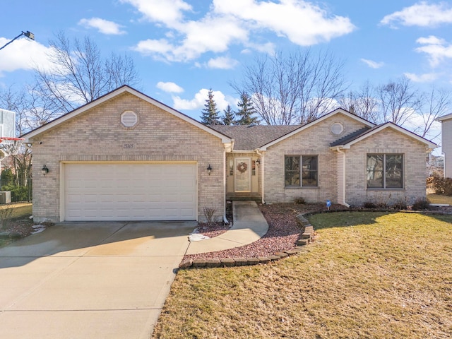 single story home featuring a front yard, brick siding, driveway, and an attached garage