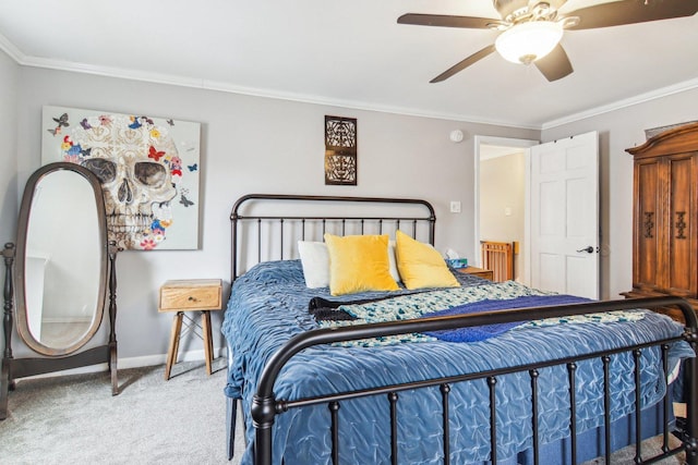 bedroom with carpet flooring, crown molding, baseboards, and ceiling fan