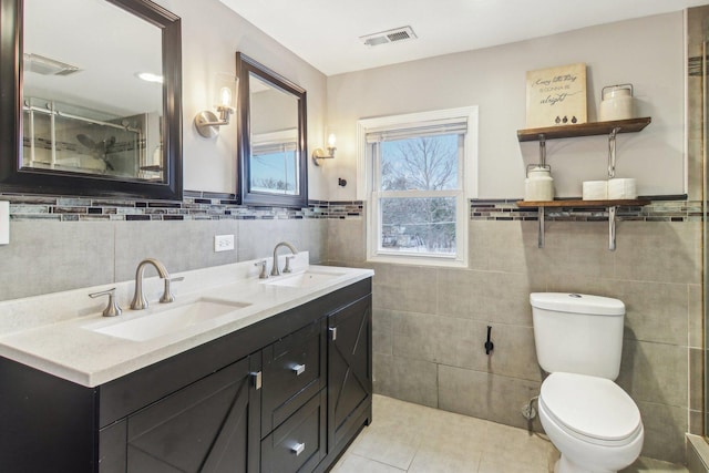 full bath featuring tile patterned flooring, visible vents, a sink, and toilet