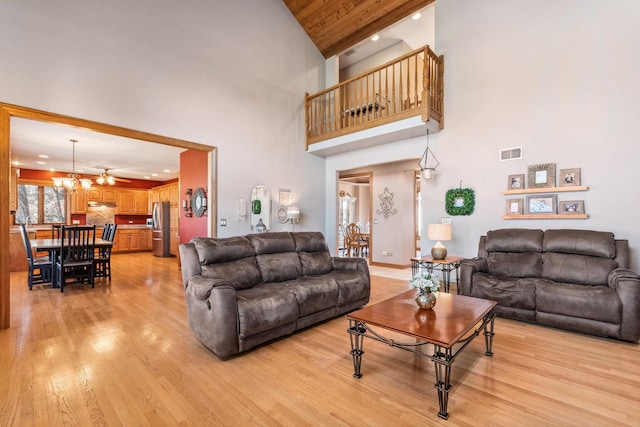 living area with a chandelier, recessed lighting, visible vents, and light wood-style floors