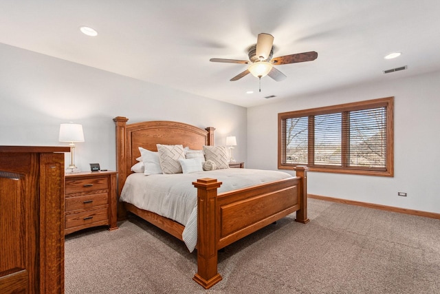 bedroom featuring light carpet, visible vents, baseboards, and a ceiling fan