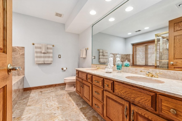 full bathroom with toilet, a sink, and visible vents