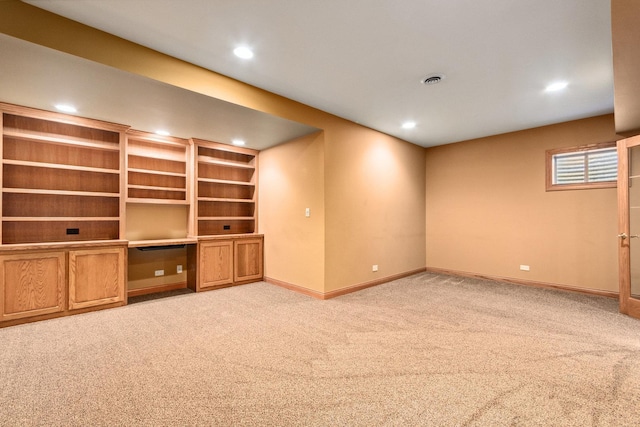 unfurnished living room featuring recessed lighting, carpet flooring, and baseboards