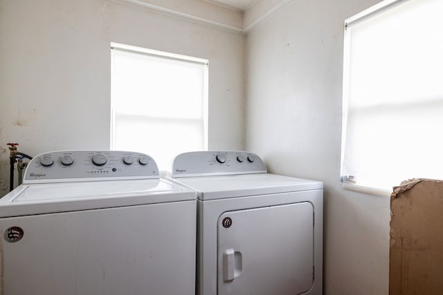 washroom featuring laundry area and washing machine and clothes dryer