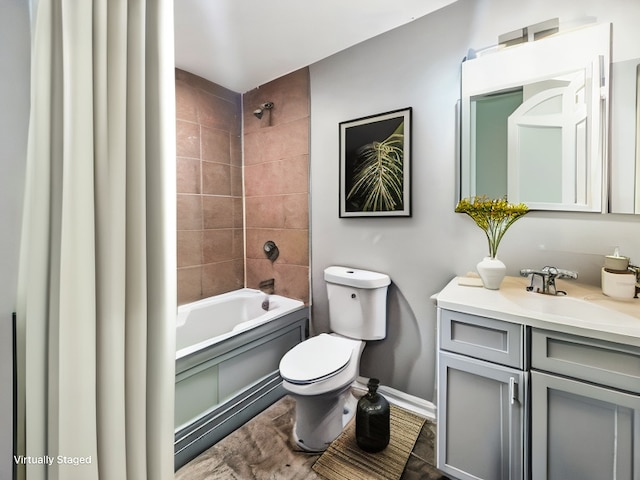 full bathroom with baseboards, vanity, toilet, and shower / bathtub combination