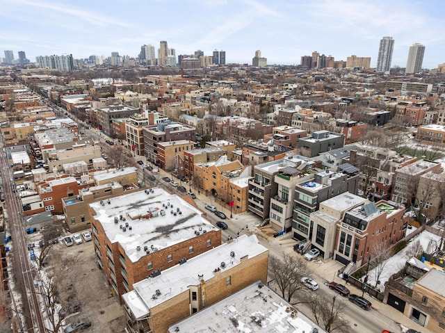 birds eye view of property with a view of city