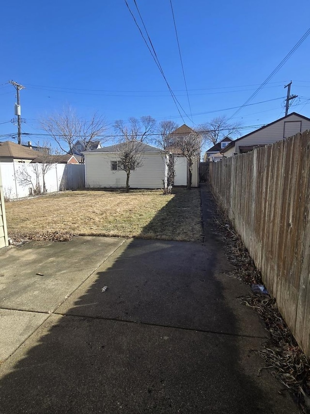 view of yard with a fenced backyard