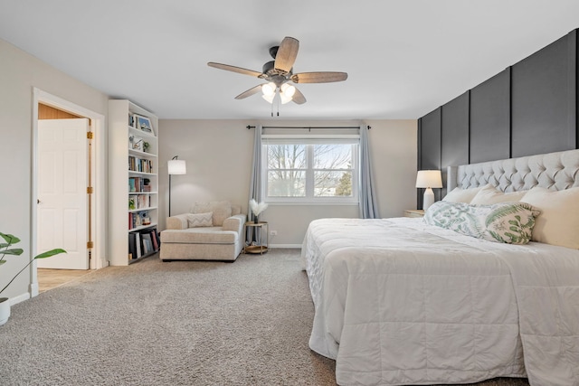 bedroom with light carpet, ceiling fan, and baseboards