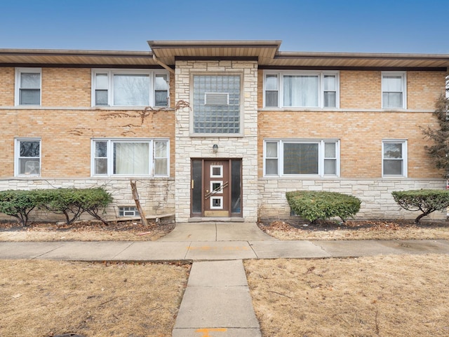 multi unit property with stone siding and brick siding