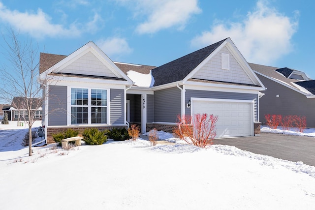 view of front of home with driveway and an attached garage