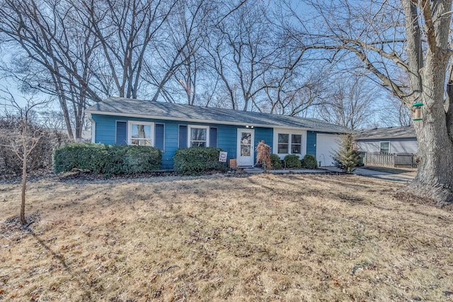 ranch-style house with a front lawn and an attached garage