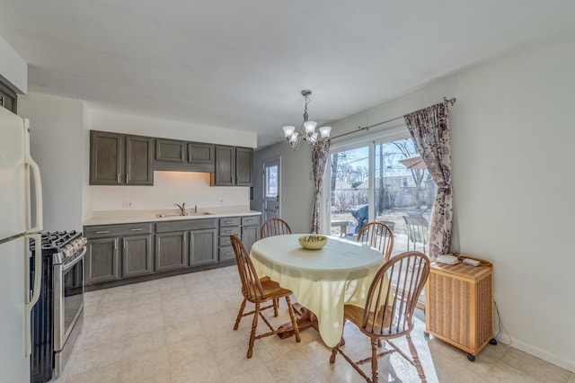 dining room featuring baseboards and a chandelier