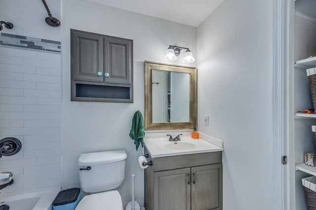 full bathroom with vanity, toilet, and washtub / shower combination