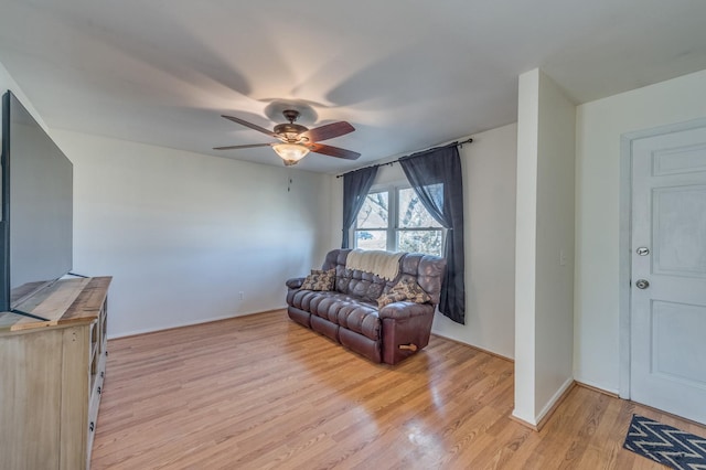 interior space with ceiling fan and light wood-style flooring