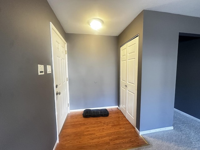 interior space with baseboards and wood finished floors