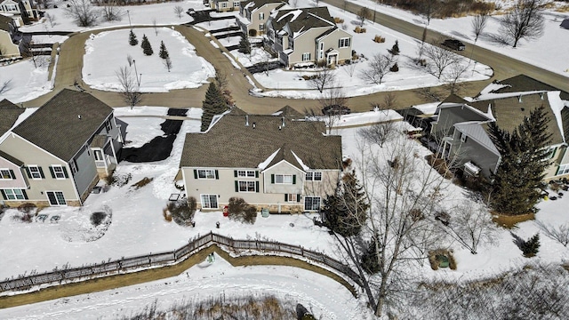 snowy aerial view featuring a residential view