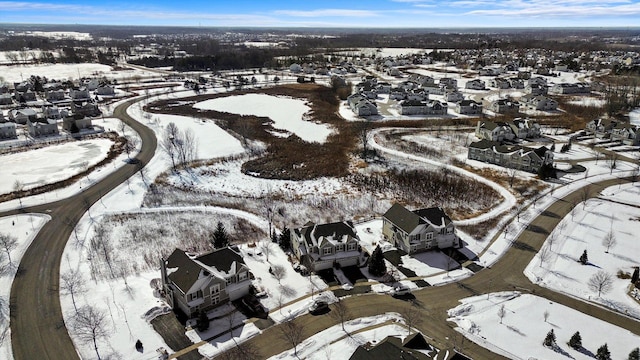 snowy aerial view featuring a residential view