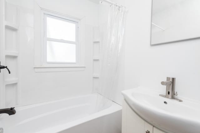 full bathroom featuring shower / bath combination with curtain and vanity