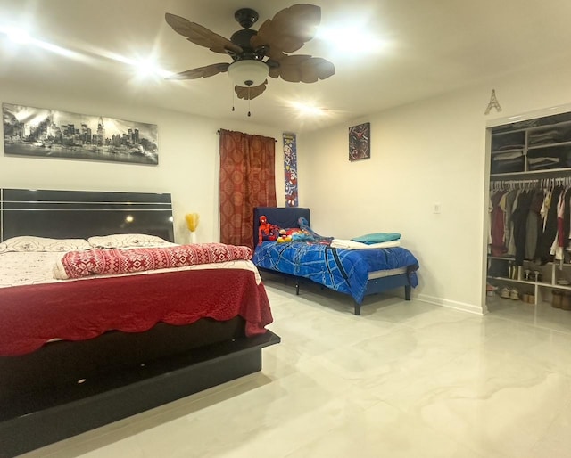 bedroom featuring a ceiling fan, baseboards, and a closet