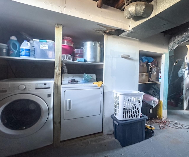 washroom featuring washing machine and dryer and laundry area