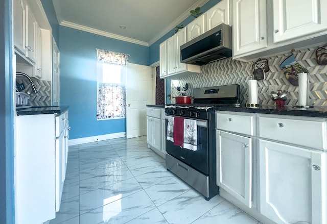 kitchen with white cabinets, marble finish floor, dark countertops, and stainless steel appliances