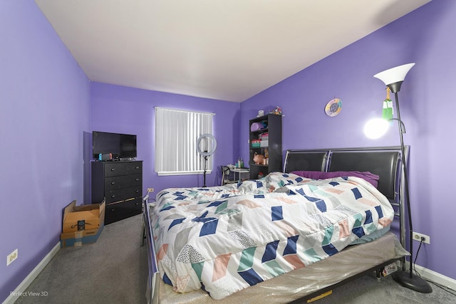 bedroom with carpet and baseboards