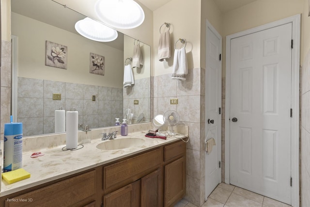 bathroom with vanity, tile walls, and tile patterned floors