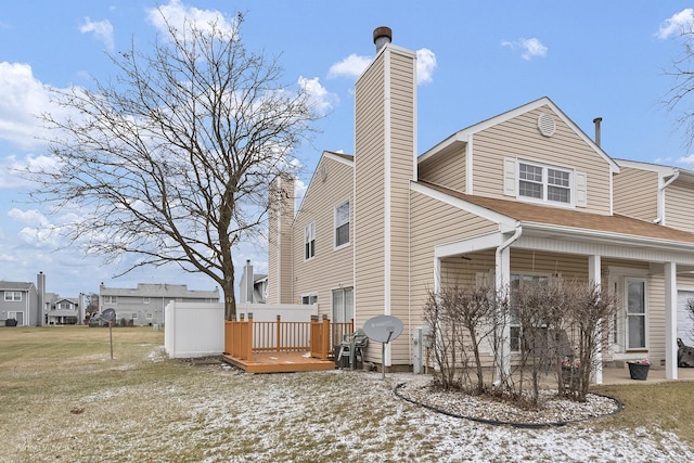 exterior space with a deck and a chimney