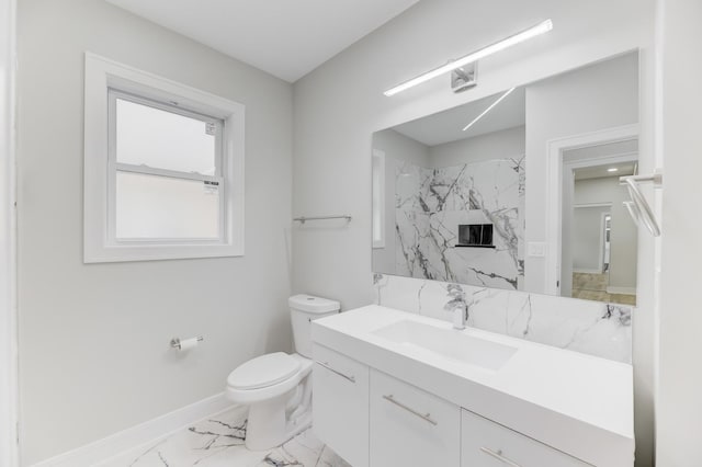 full bath with baseboards, a shower, toilet, marble finish floor, and vanity