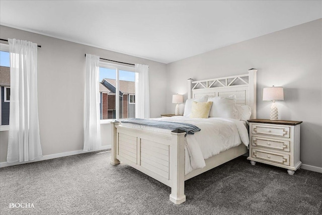 bedroom featuring baseboards and dark colored carpet