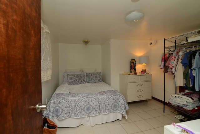 bedroom with light tile patterned flooring