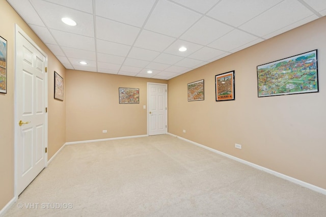 unfurnished room with baseboards, recessed lighting, a paneled ceiling, and light colored carpet