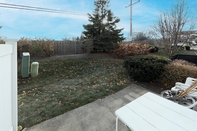 view of yard featuring fence and a patio