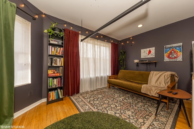 interior space featuring wood finished floors and baseboards